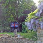 The union Jack proudly displayed in a garden